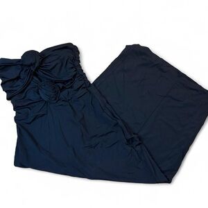 Black strapless maxi dress with ruffled flower detail. Size small.